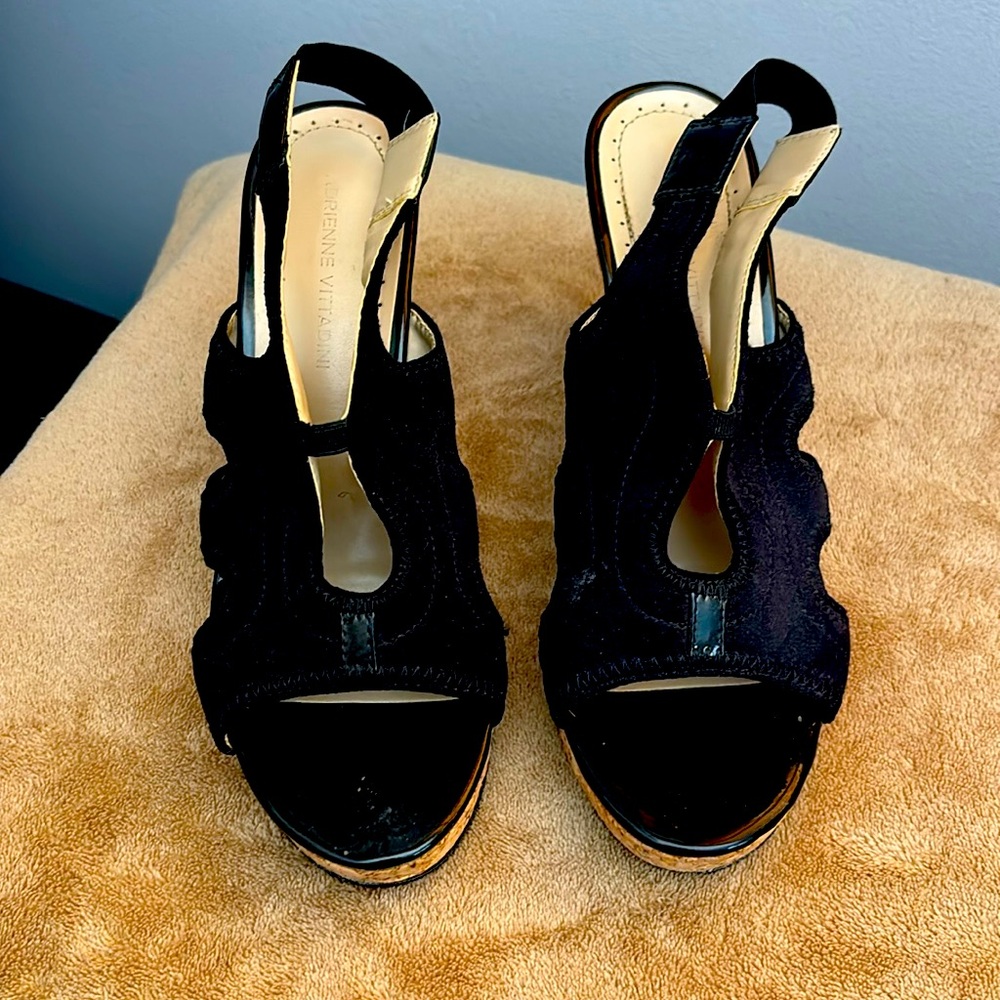 Black 4” platform sandals with cork heel. Gently worn 2-3 times